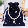 Charm Themed Jewelry Pouch with Beaded Detail and Starry Night Print for Unique Gift Packaging and Collection Storage